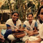 A group of girls, different ages, sit and talk about the first time they heard about menstruation.