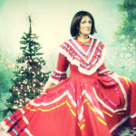 Martina shows off a handmade vintage Mexican gown at "Chestnuts" antique store in Suttons Bay, Michigan.