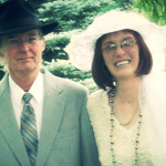 Martina models a vintage wedding gown and hat with her husband on their property in Traverse City, Michigan.